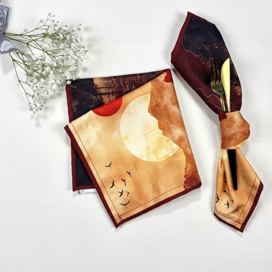 Scarf with moon and bird design on a white background